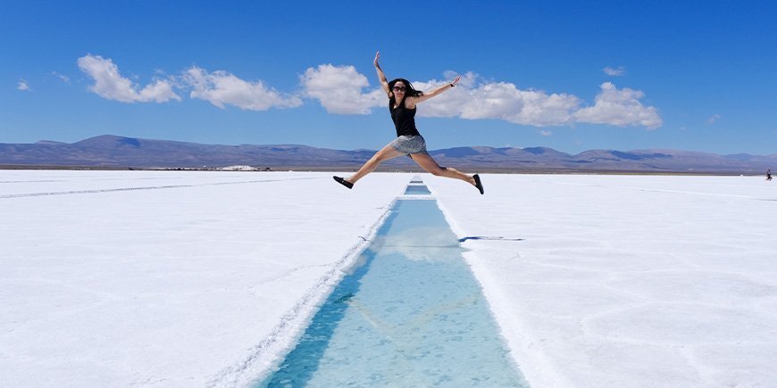 Woman jumps in Salinas Grandes in Argentina