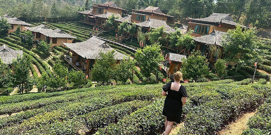 Michelle walks through the landscapes of Ban Rak Thai