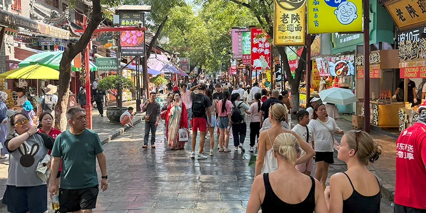 Claus' daughters walk down the street in China