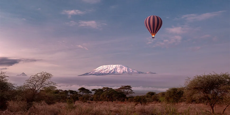 On safari in a hot air balloon over Amboseli in Kenya with a view of Kilimanjaro