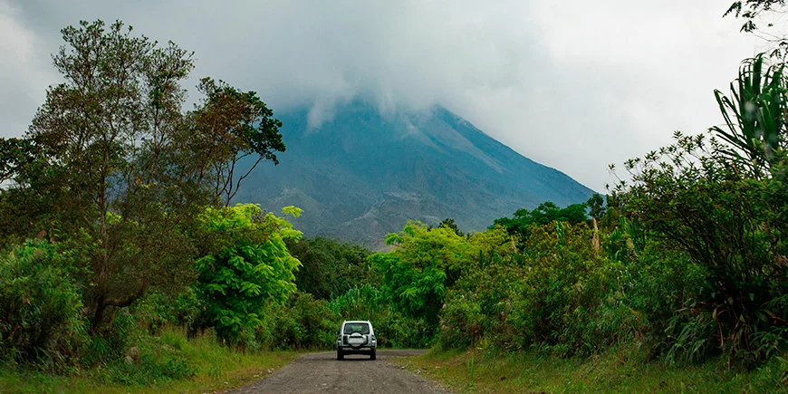 Car driving towards Arenal Volcano in Costa Rica