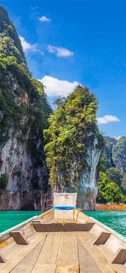 Long-tail boat on a lake at Khao Sok National Park, Thailand