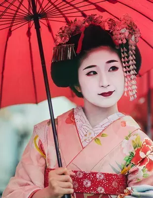 Japanese geisha under an umbrella