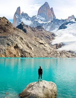 Woman admiring the beauty of Mount Fitz Roy in Patagonia