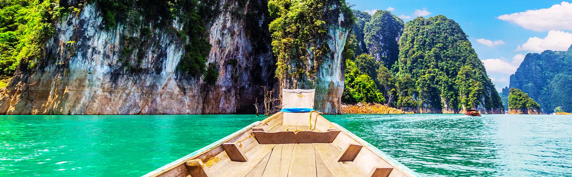 Long-tail boat on a lake at Khao Sok National Park, Thailand