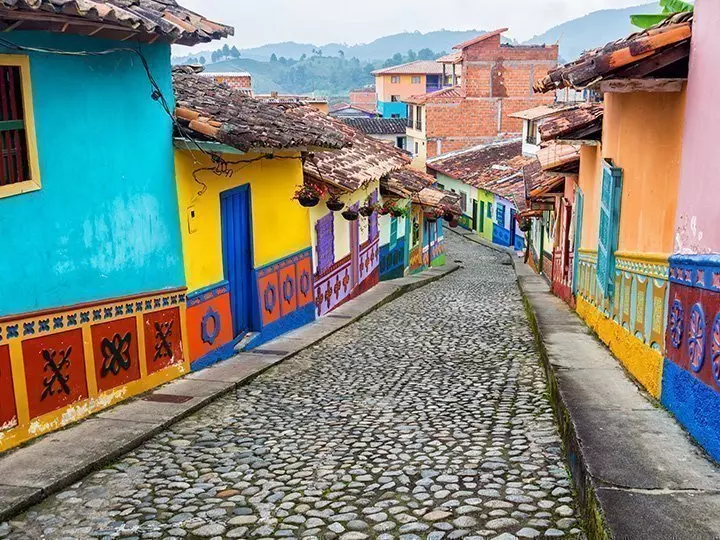 Colourful colonial houses on a cobbled street in Guatape, Antioquia in Colombia