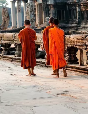 3 monks walking at Angkor Wat