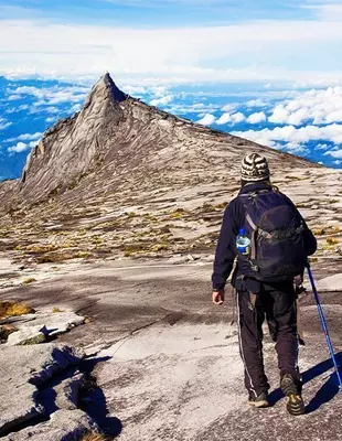 Man trekking on Mount Kinabalu in Malaysia