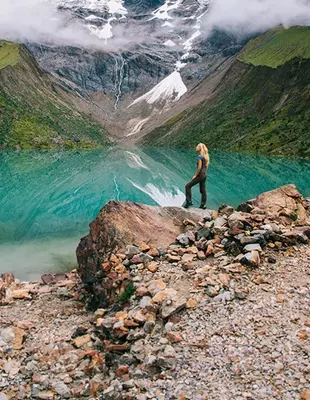 Female tourist admiring the landscape while hiking in Salkantay